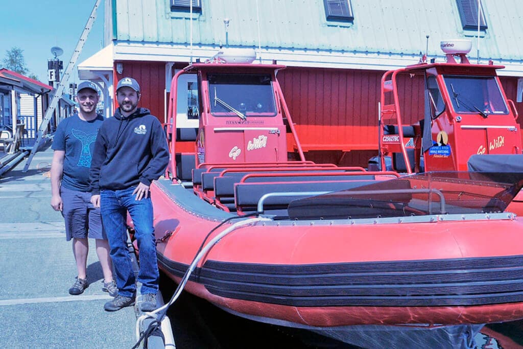 Stephen Gabrysh and Tyler Bruce next to one of our Zodiac vessels