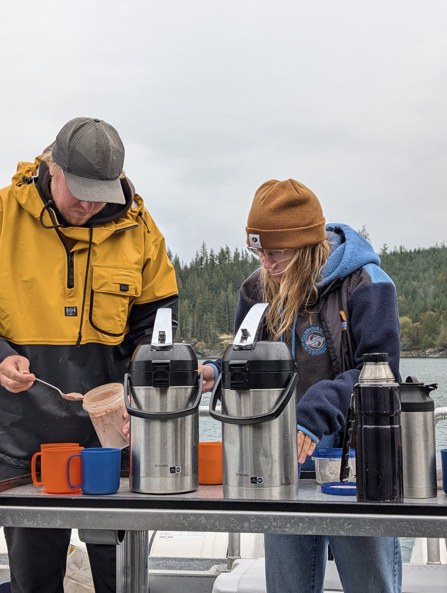 Guides preparing hot beverages on a tour